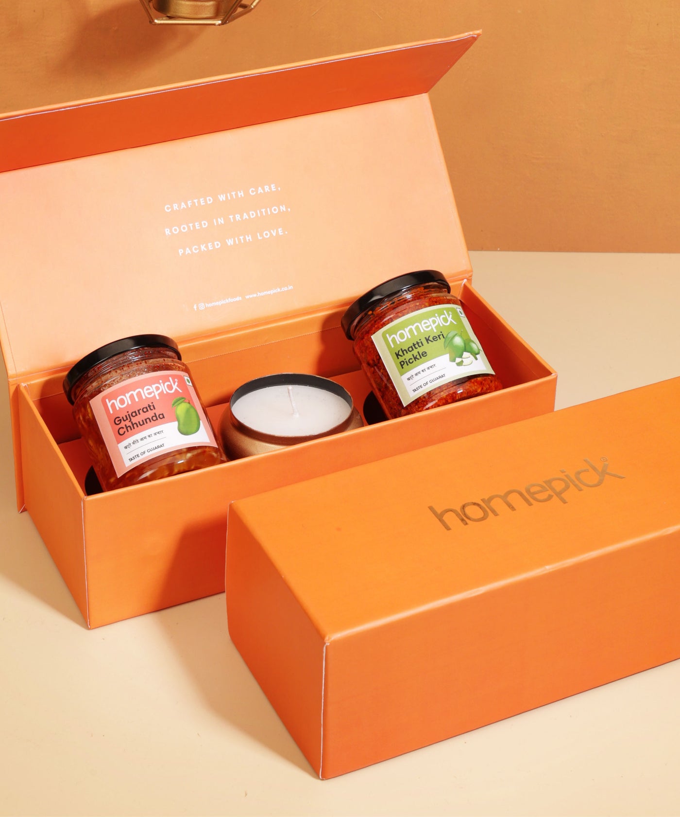 Orange gift box with 'homepick' branding containing jars 